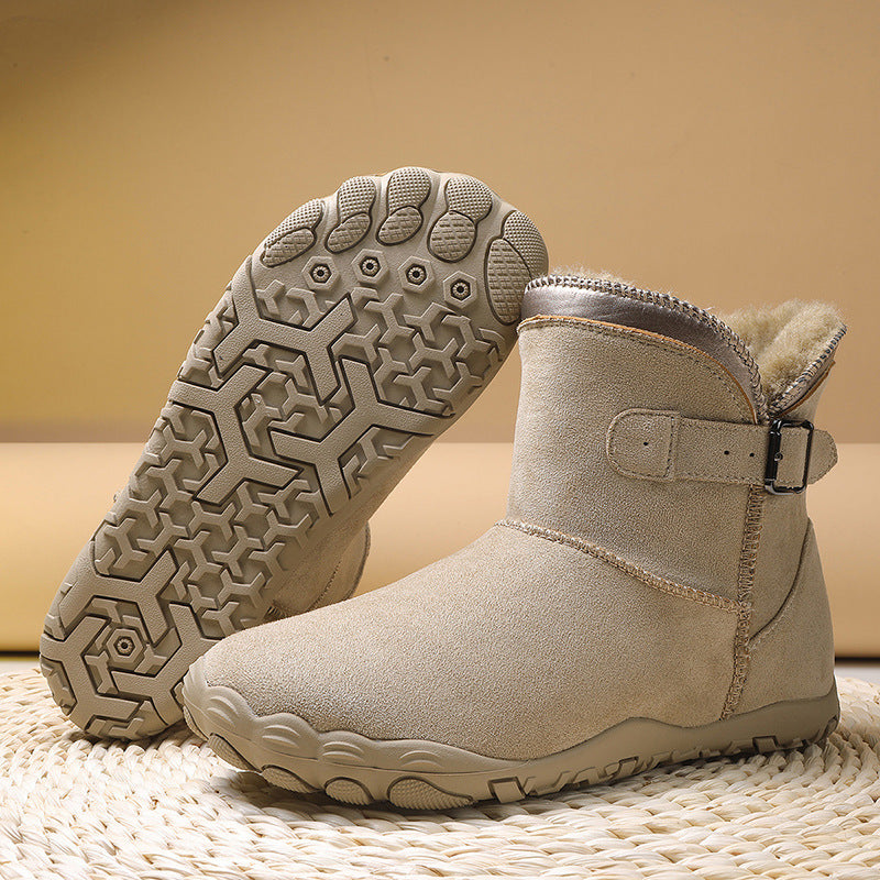 Women's winter boots in light tan, buckle strap, faux fur collar, rugged tread outsole.
