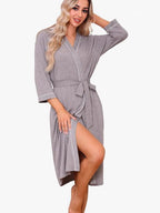 Lightweight wrap kimono robe in gray with contrast piping and tied waist belt, knee length