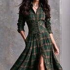 Green plaid shirt dress with lace-up corset belt, long sleeves, button front, slit hem.