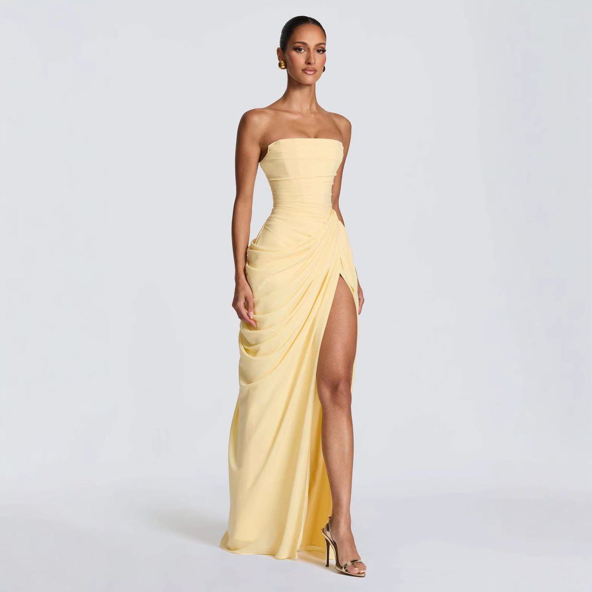 Strapless ruched maxi dress in pale yellow with draped side slit, sleeveless formal gown