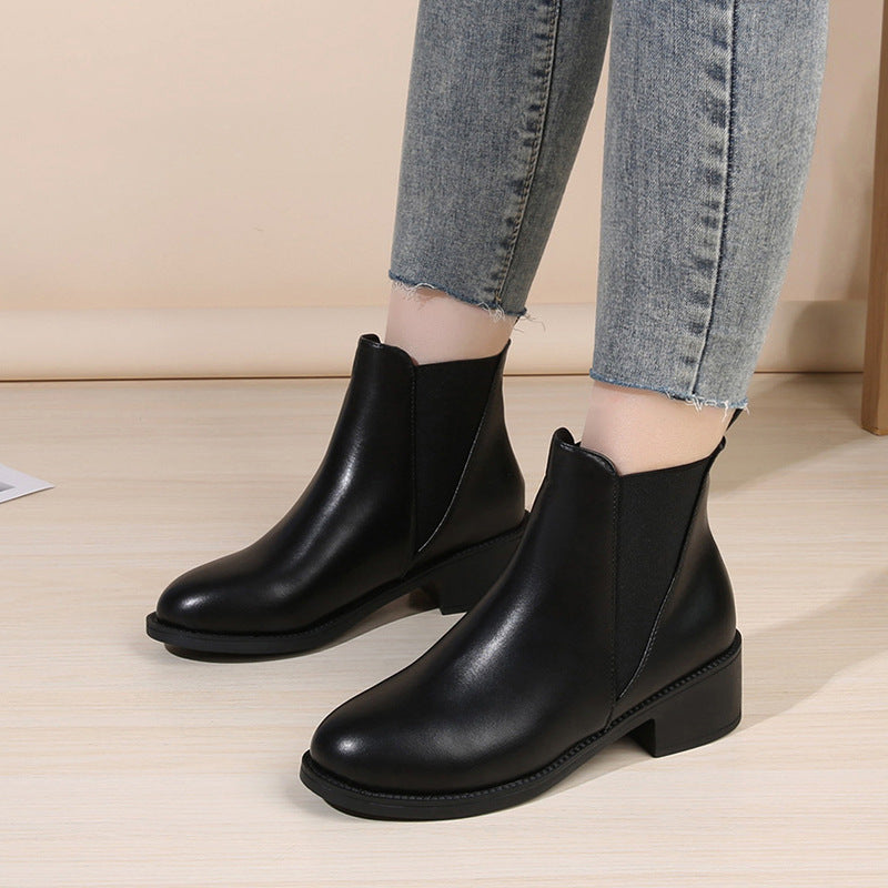 Black chelsea ankle boots with chunky block heel, round toe, pull-on style