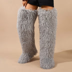 Light gray shaggy faux fur boots shown worn to the thigh.