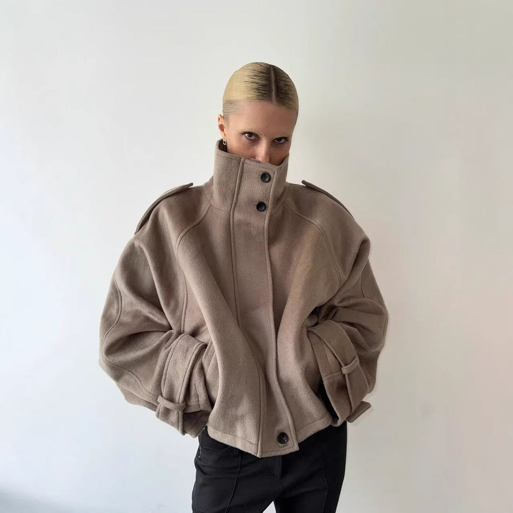 Taupe cropped wool jacket, funnel neck, button front, epaulettes, cuff tabs.