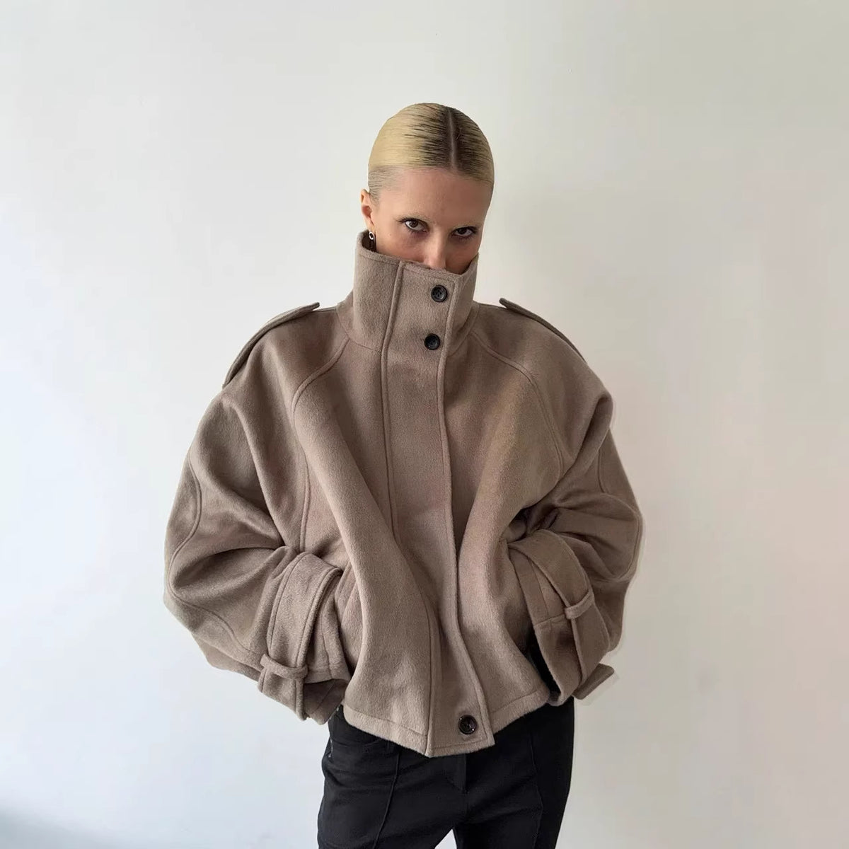 Taupe cropped wool jacket, funnel neck, button front, epaulettes, cuff tabs.