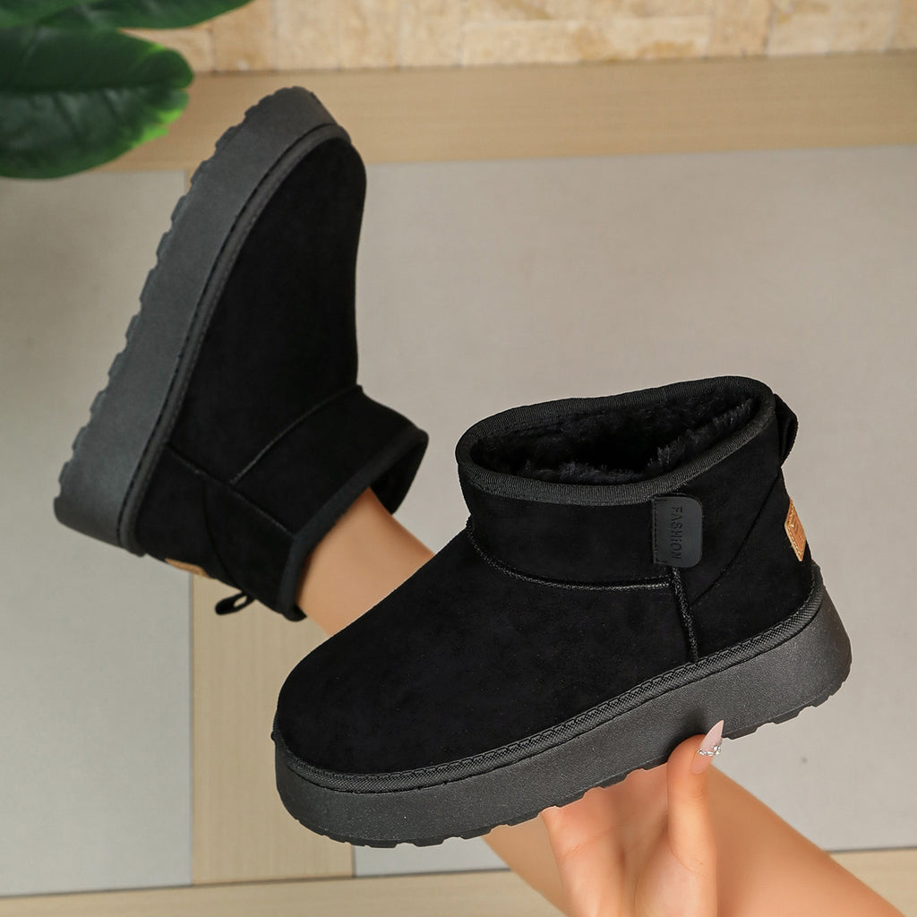 Women’s black short snow boots with ankle strap, thick sole, and plush fleece collar