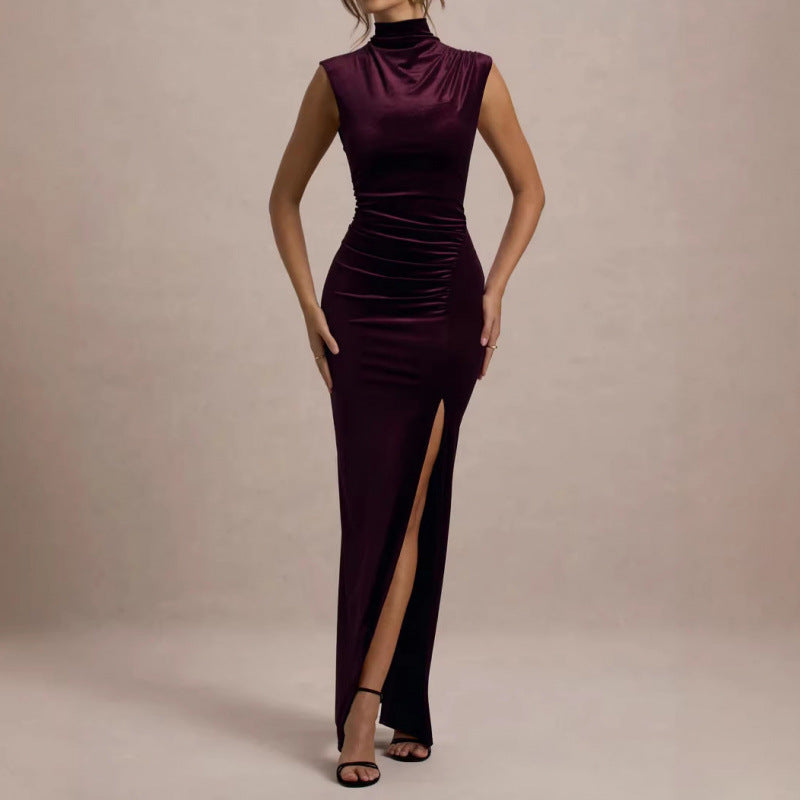 Burgundy velvet maxi dress with sleeveless mock neck and ruched bodycon style, slit