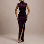 Burgundy velvet maxi dress with sleeveless mock neck and ruched bodycon style, slit