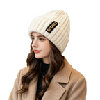 Chunky ribbed beanie in off-white with folded cuff and letter patch