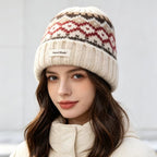 Women’s knit beanie with Fair Isle pattern and ribbed cuff, cream with red and black trim