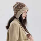 Fair Isle knit earflap bonnet with long ties, tan and brown speckled fair isle