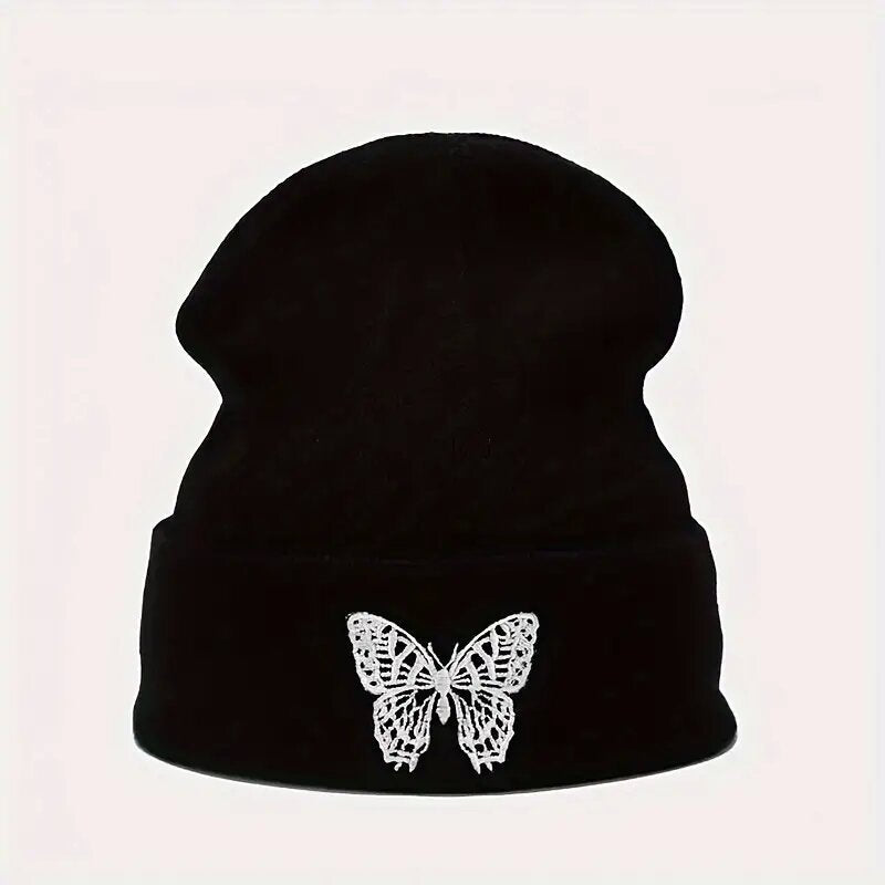 Black knitted beanie hat with white butterfly embroidery on front
