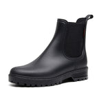Women's black chelsea rain boots, elastic side panels, textured lug rubber outsole