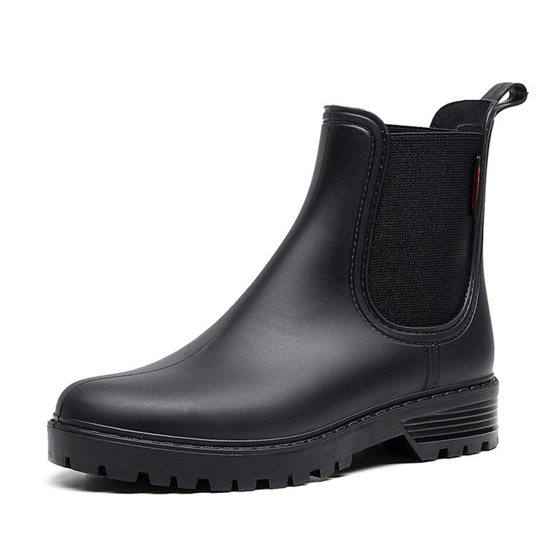 Women's black chelsea rain boots, elastic side panels, textured lug rubber outsole