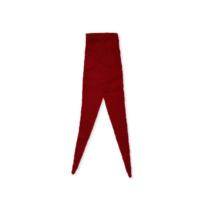 Red wool knit skinny scarf, pointed ends and ribbed texture on white background.