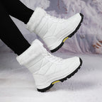 Women’s mid-calf faux fur lace-up snow boots in white, quilted design with treaded sole
