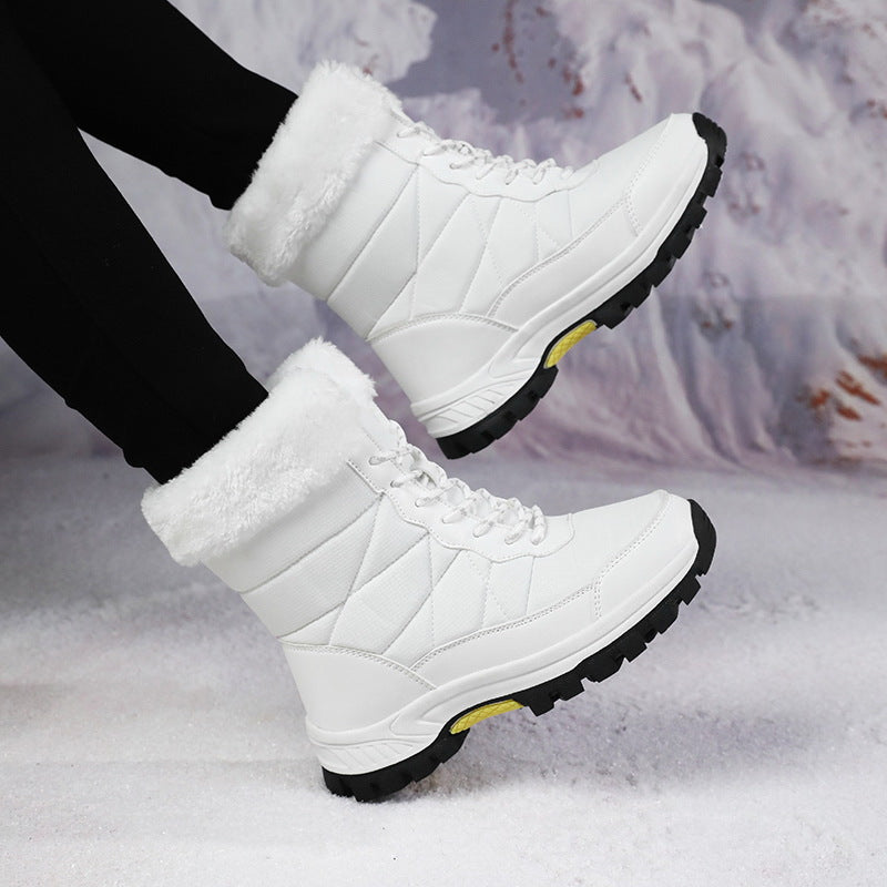 Women’s mid-calf faux fur lace-up snow boots in white, quilted design with treaded sole