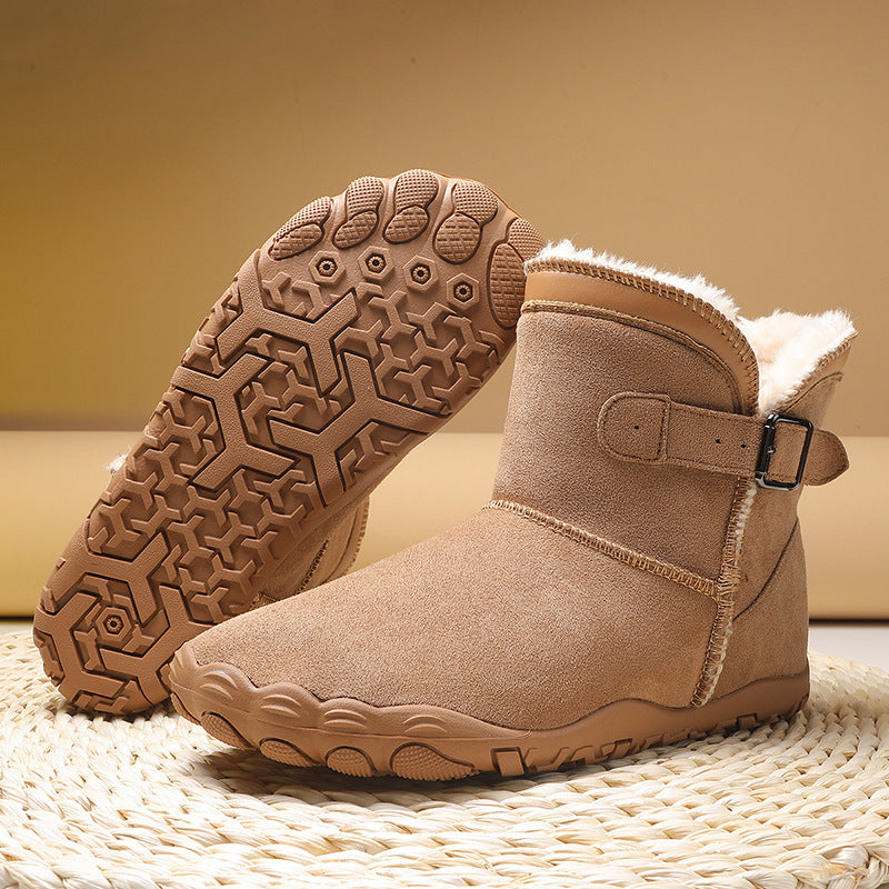Women's winter boots in tan suede, buckle strap, faux fur lining, rugged tread sole.