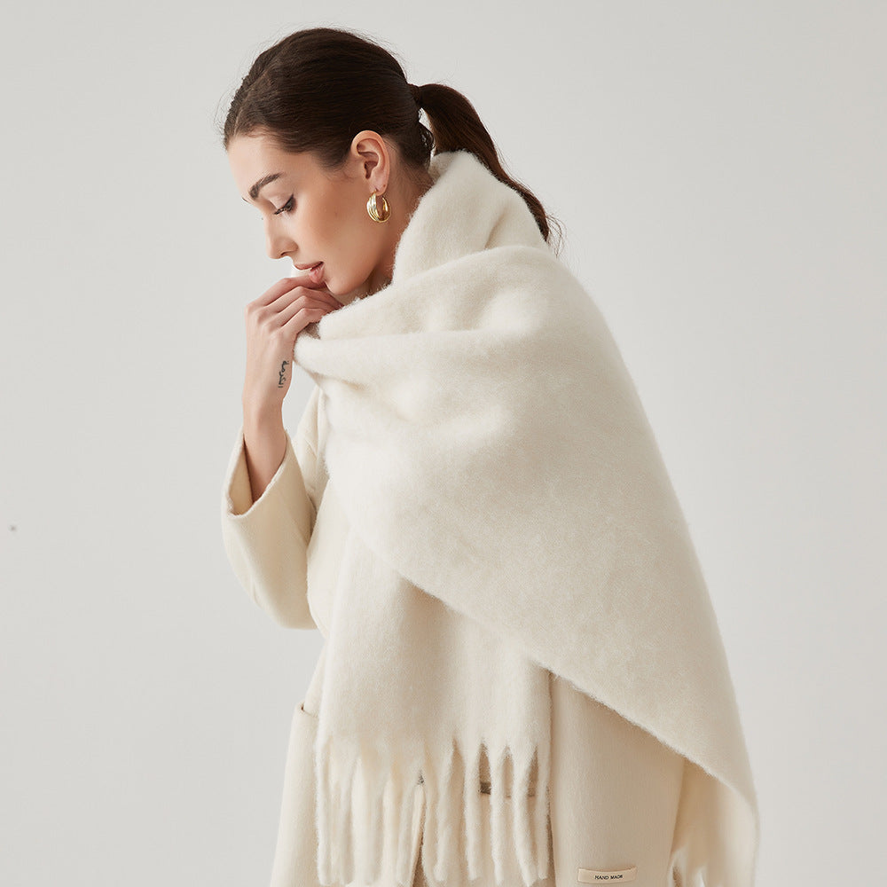 Oversized fuzzy mohair-blend scarf with fringe ends, cream, worn draped over shoulders