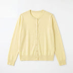 Light yellow crew-neck cardigan sweater with button front, fine knit