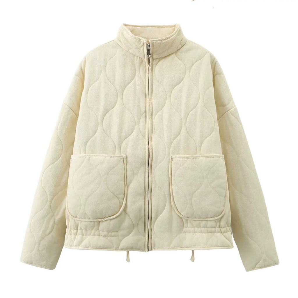 Off-white quilted stand-collar zip-up jacket with long sleeves and two flap chest pockets.
