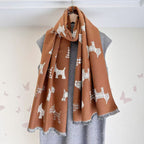 Camel jacquard blanket scarf with white dog prints and gray fringe