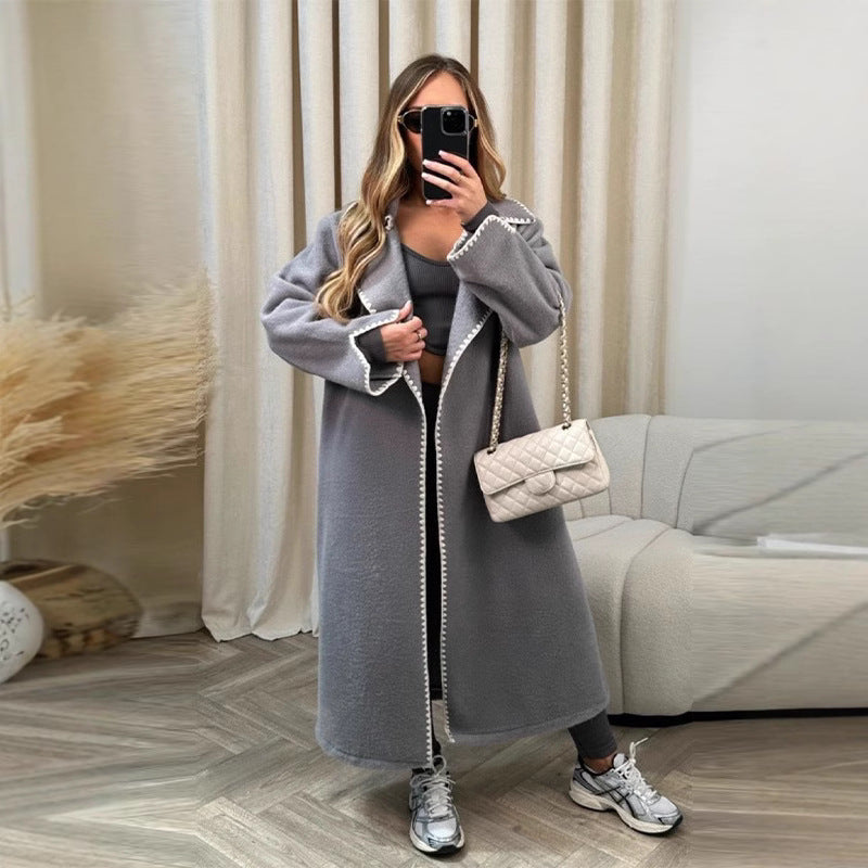 Gray long open-front wool coat with contrast trim, relaxed oversized silhouette