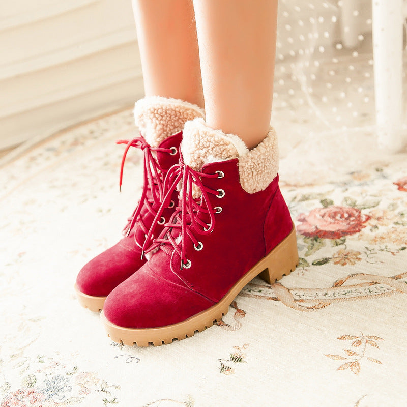 Red faux suede lace-up ankle boots with sherpa cuffs and lug soles