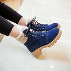 Blue faux suede ankle boots with sherpa cuffs and chunky lug soles