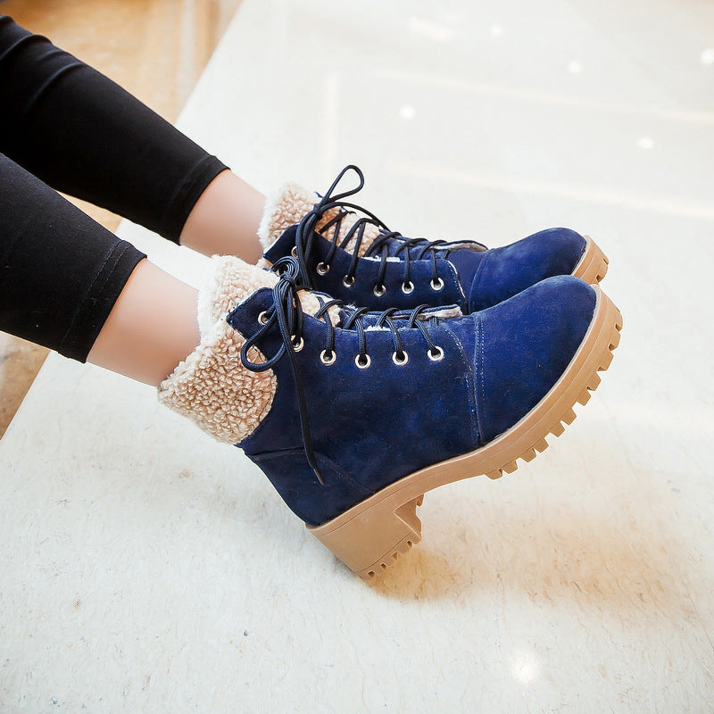 Blue faux suede ankle boots with sherpa cuffs and chunky lug soles
