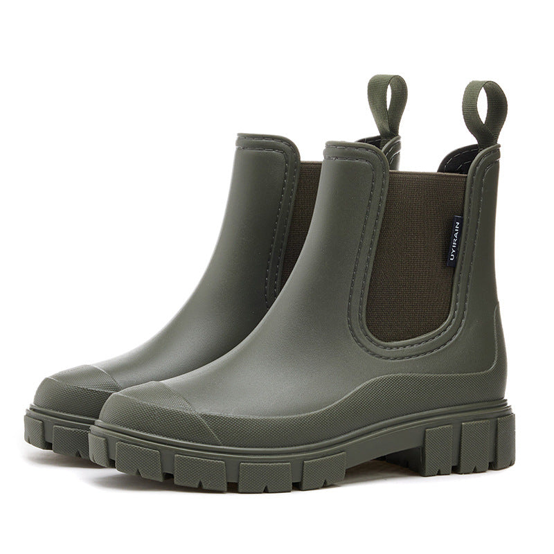 Chelsea rain boots in dark olive green matte rubber with side elastic panels and lug sole.