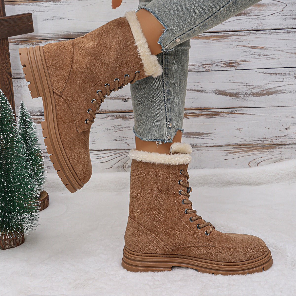Camel lace-up combat snow boots with faux fur lining, fold cuff, and treaded sole