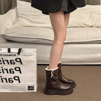 Brown faux leather winter boots with faux-fur cuff and buckle strap hardware