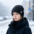 Black ribbed knit beanie with fleece lining and logo patch