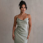 Light green satin maxi dress with thin spaghetti straps and cowl neckline slip fit.