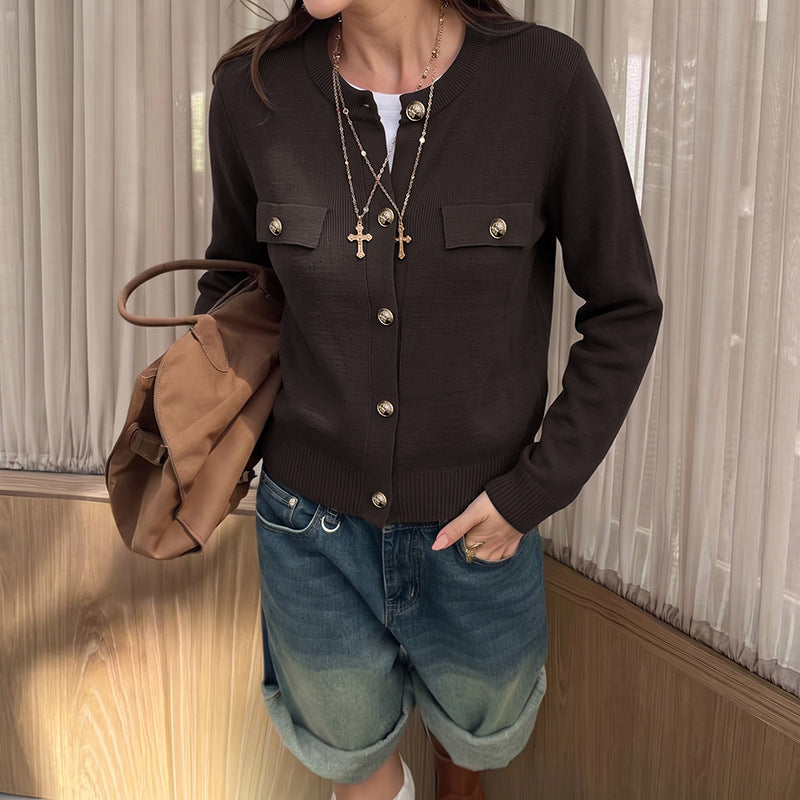 Dark brown knit cardigan with gold buttons and flap pockets, crew neck, ribbed cuffs