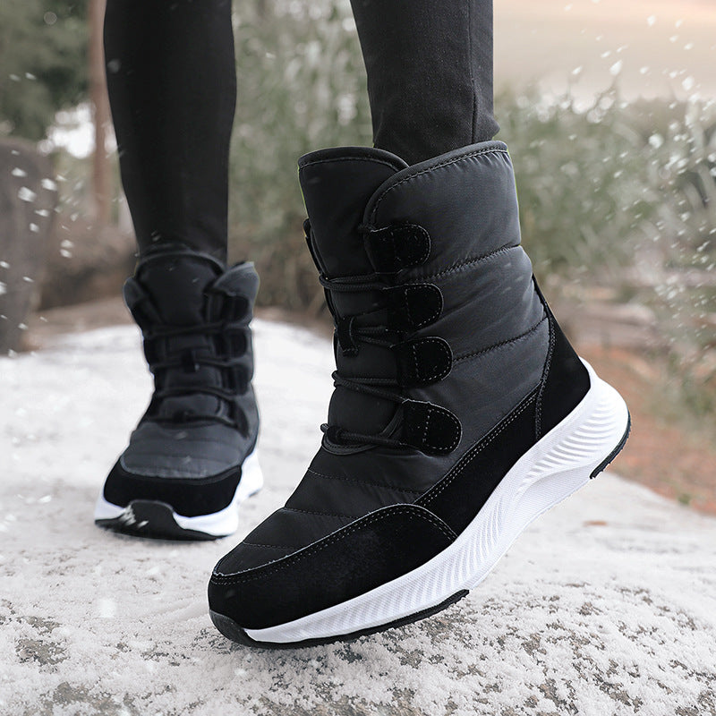 Women's fleece-lined snow boots, black high-top with hook-and-loop straps and white sole