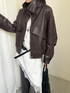 Cropped dark brown faux leather jacket with stand collar, zip front, and patch flap pockets