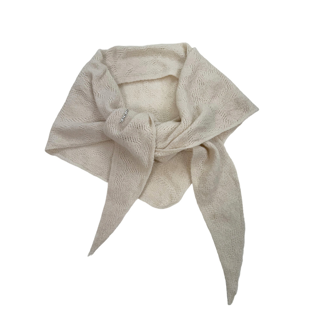 Ivory knit triangle scarf with openwork pattern, tied at the center