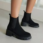 Black suede Chelsea boots with elastic gore and thick lug sole, low block heel