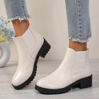 Women’s chunky Chelsea boots in off-white with elastic sides and lug sole, block heel.
