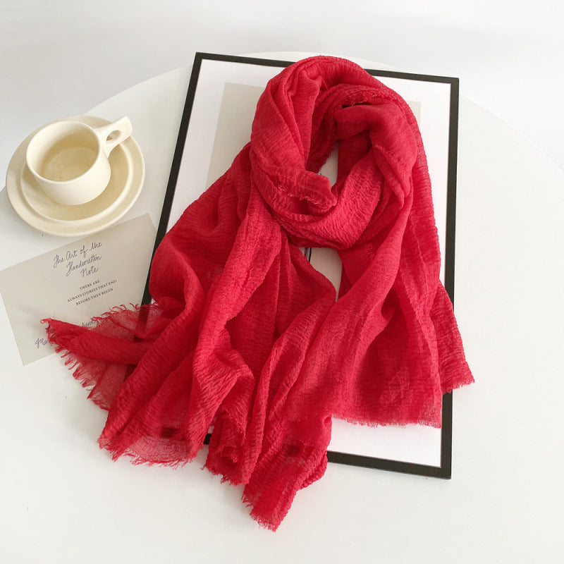 Red cotton gauze scarf with crinkle texture and frayed fringe ends, long wrap