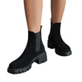 Black suede Chelsea ankle boots with elastic gore and chunky lug sole, stacked heel