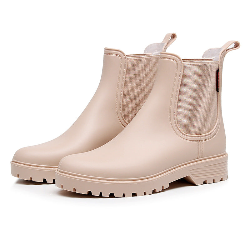Women's beige chelsea rain boots with elastic side panels and chunky lug sole