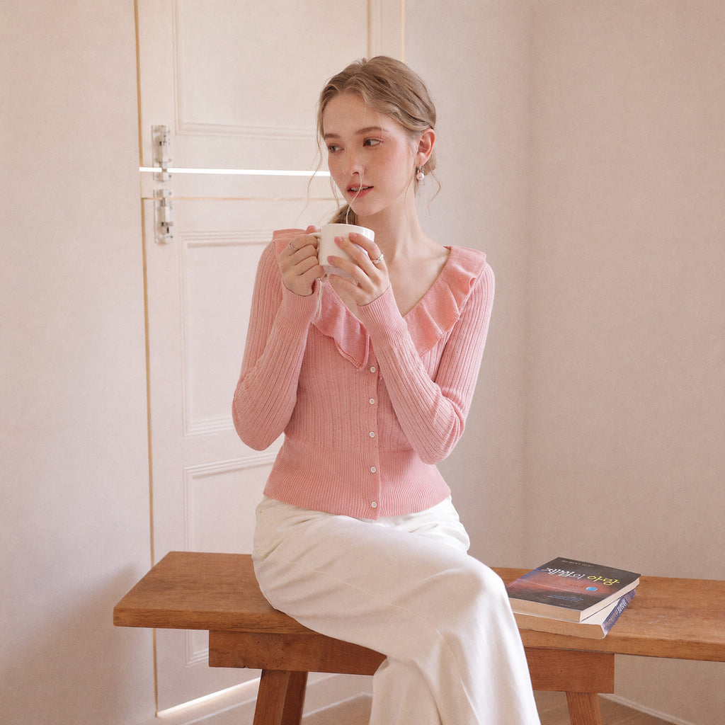 Pink knit cardigan with ruffle V-neck collar and button front, long sleeves