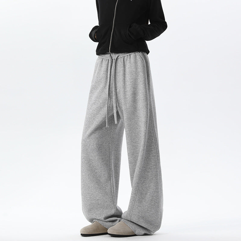 Women's light gray wide-leg sweatpants with drawstring waist and relaxed fit