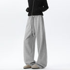 Women's light gray wide-leg sweatpants with drawstring waist and relaxed fit