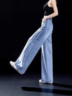 Light blue high-waisted wide-leg jeans with belt loops and front seam detail