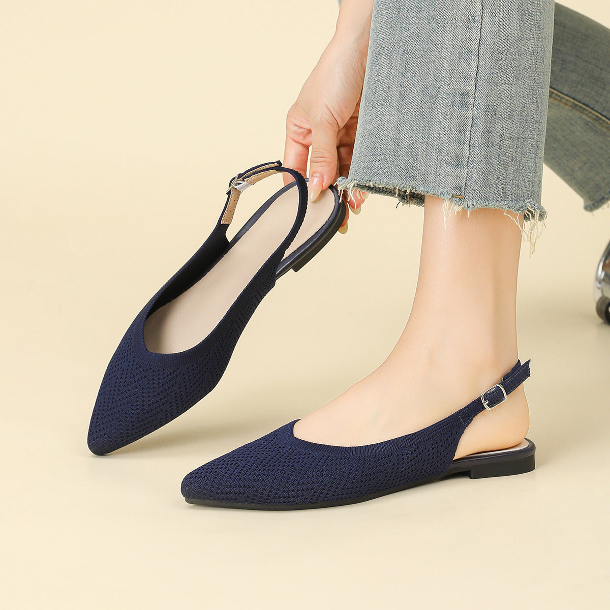 Woven pointed-toe slingback flats with thick sole, dark blue, worn with cuffed denim