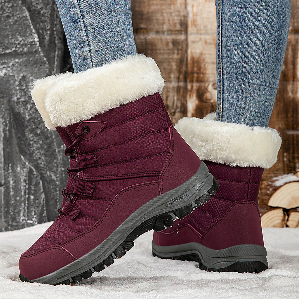 Women’s burgundy lace-up winter boots with faux-fur cuffs and grippy lug sole