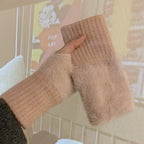 Pink fuzzy fingerless gloves with ribbed cuffs
